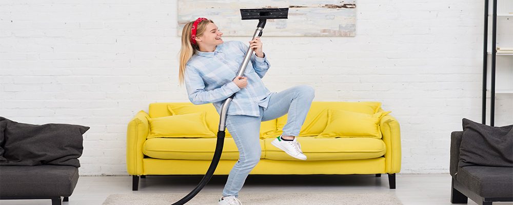 woman-doing-carpet-cleaning-with-vaccume